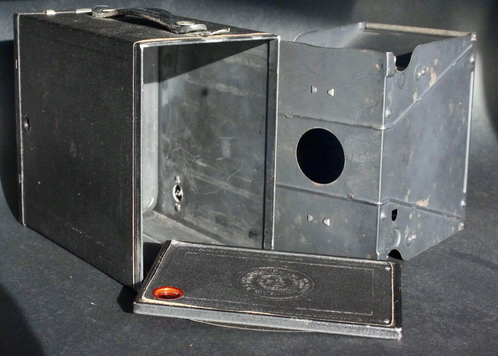 The three basic component parts of the camera. Outer shell with working parts, the inner section that carries the film and the back.