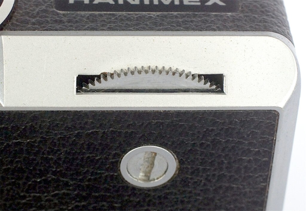 Unusual film wind location on front edge.