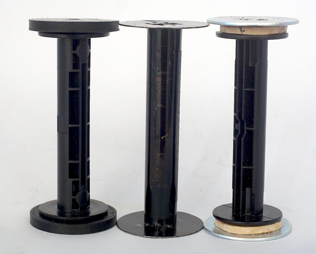 The two types of adapter, fabricated and 3D printed with 116 spool in the centre for comparison.