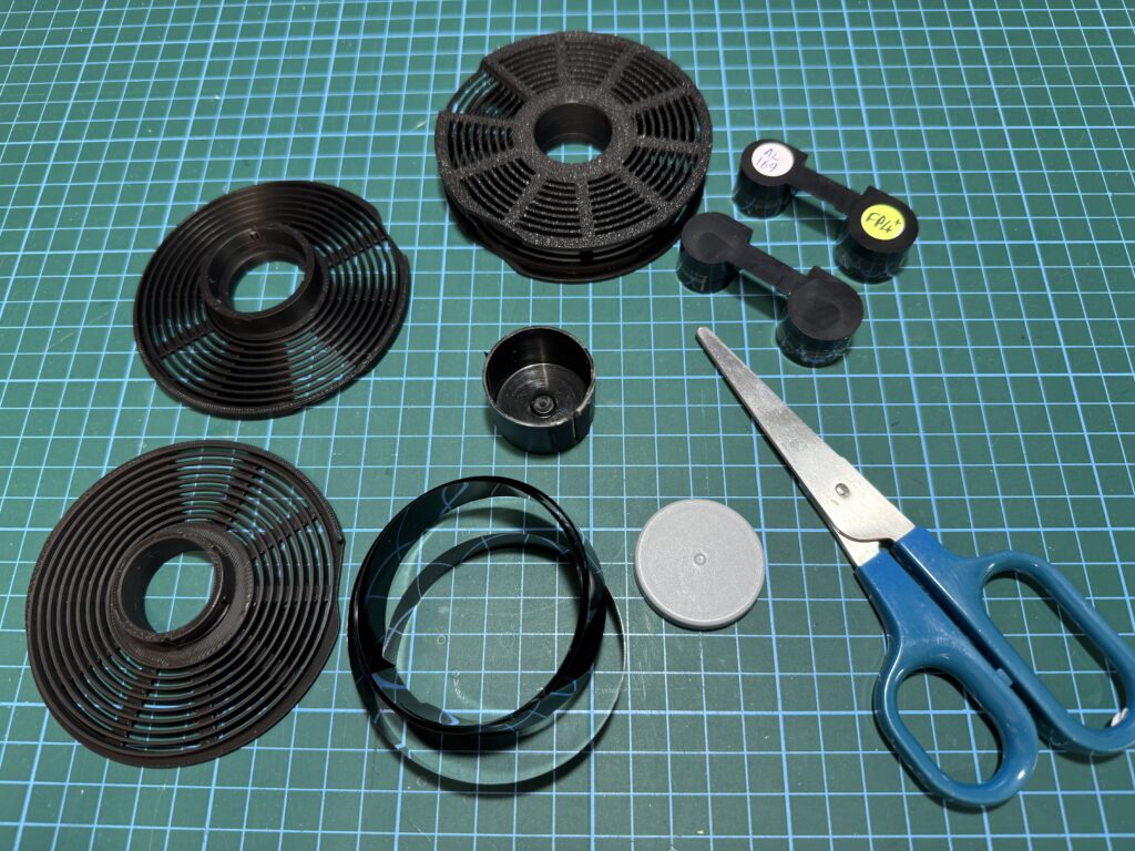 Recommend using a DIY film 'cassette' made from a cut-down 35mm film canister to avoid having film snaking round your work bench
