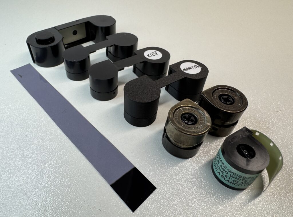Different designs of 16mm film cassettes, different sizes, different formats