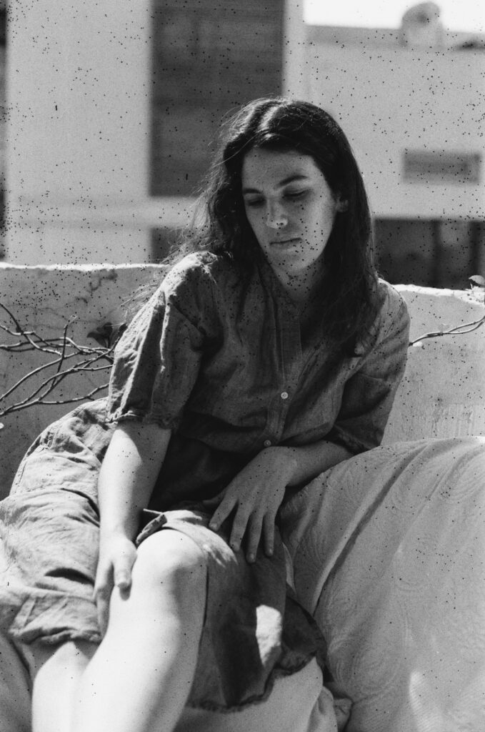 a woman sitting on a sofa