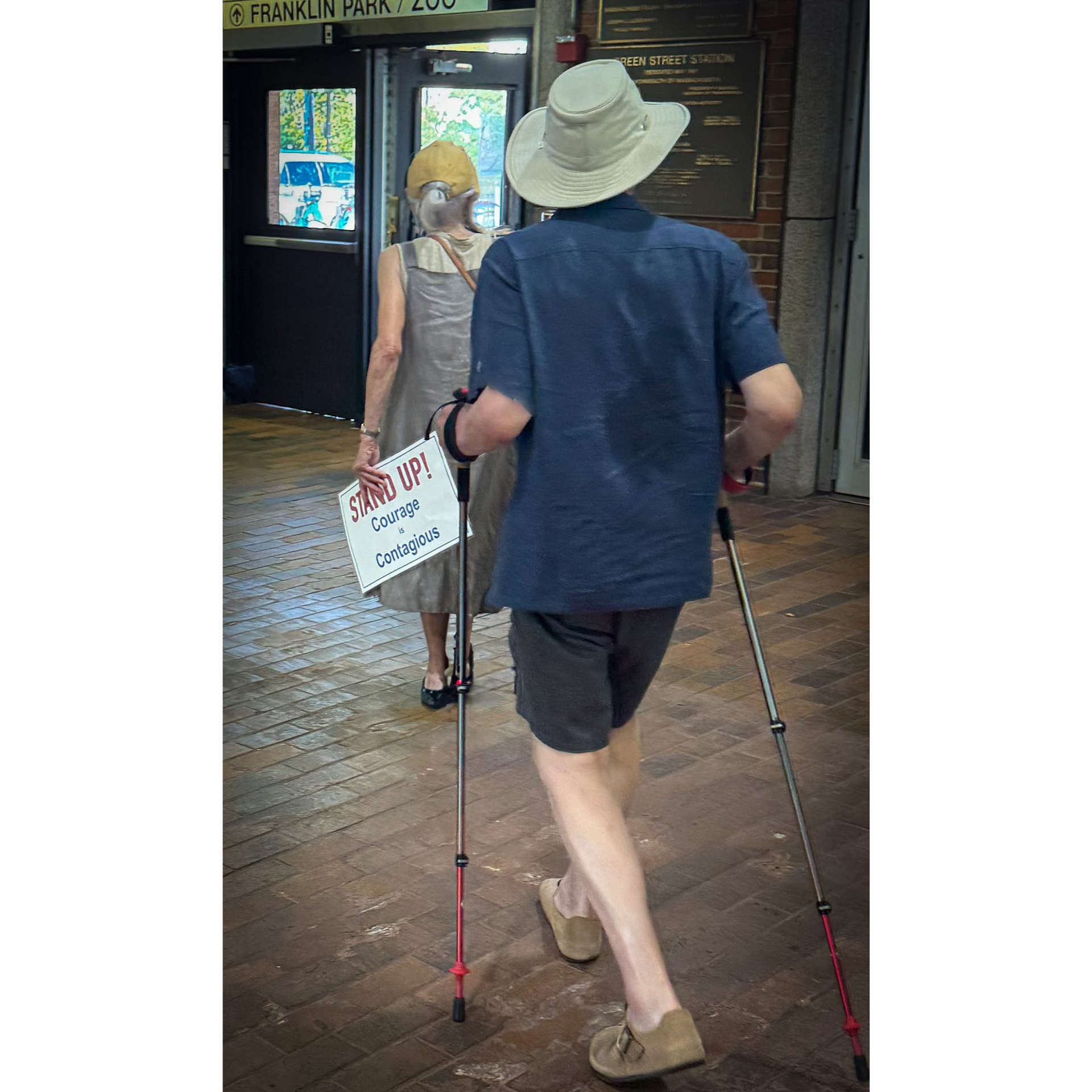 Photo of a couple leaving a Boston train station.