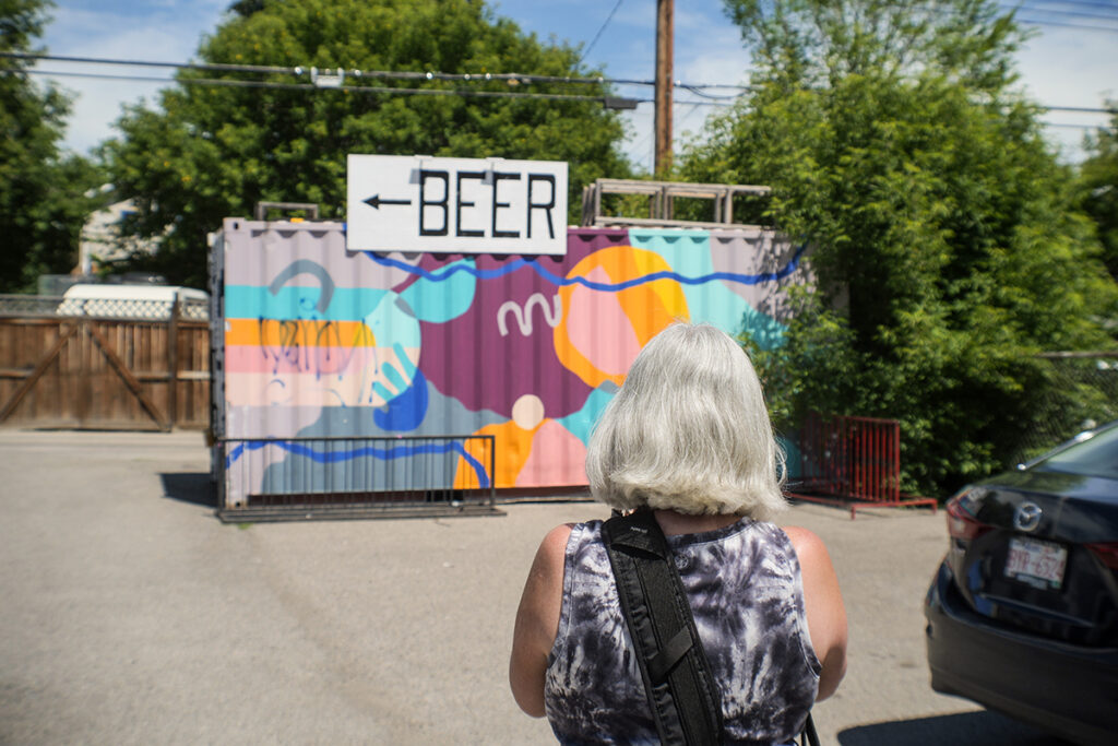 Beer this way plus female in forground