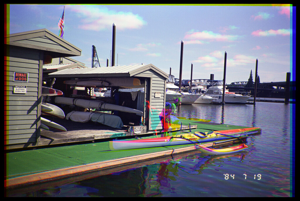 Color trichrome of an outrigger canoe being prepared to put in the river