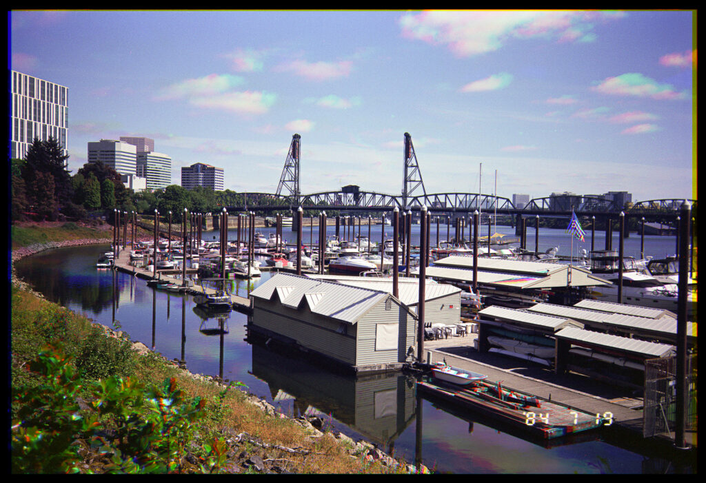 Color trichrome of the docks on the Willamette River in Portland, Oregon with the Hawthorne Bridge in the background