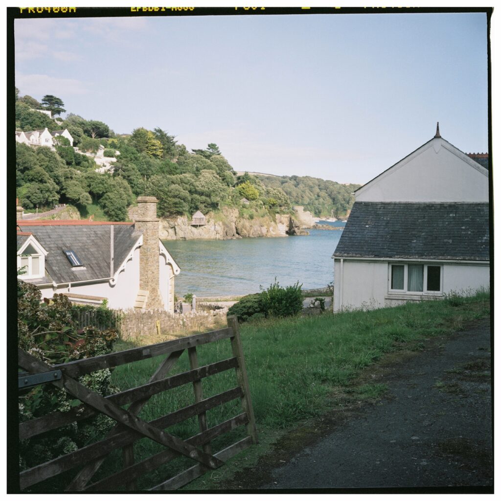 A view of the sea between to coastal houses