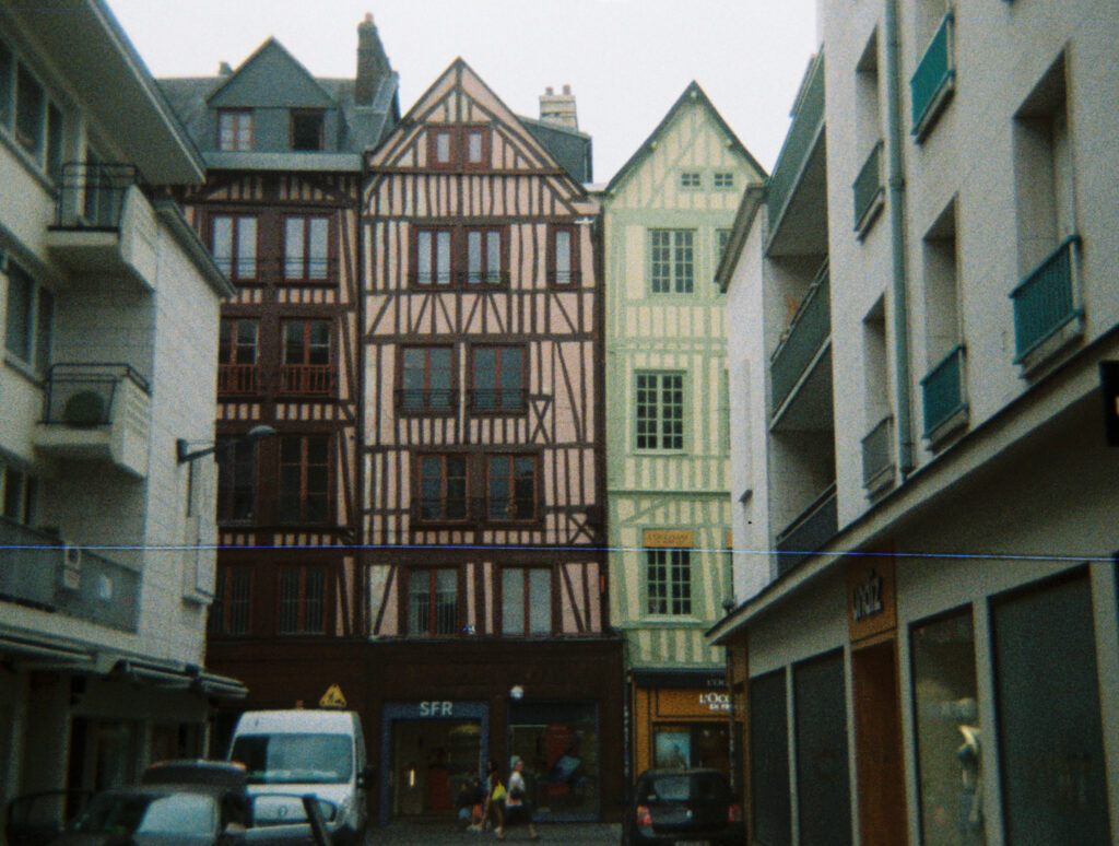 some old French buildings next to post-war flats
