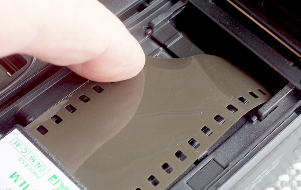 To load, film is simply threaded into the take-up chamber.