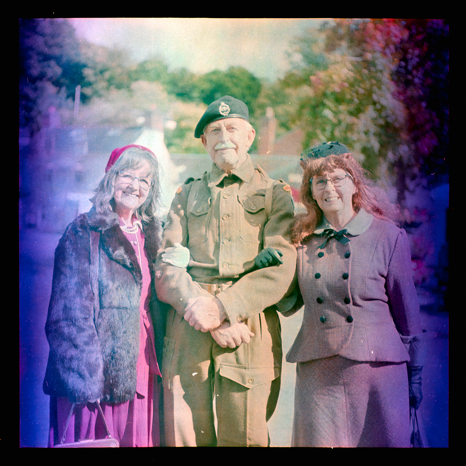 World war 2 soldier with two ladies in costume Taken with Yashica Mat EM and 47-year old Kodacolor 400 expired in 1997 rated at ISO12