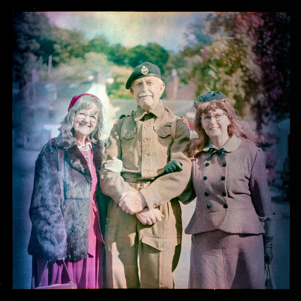 World war 2 soldier with two ladies in costume Taken with Yashica Mat EM and 47-year old Kodacolor 400 expired in 1997 rated at ISO12