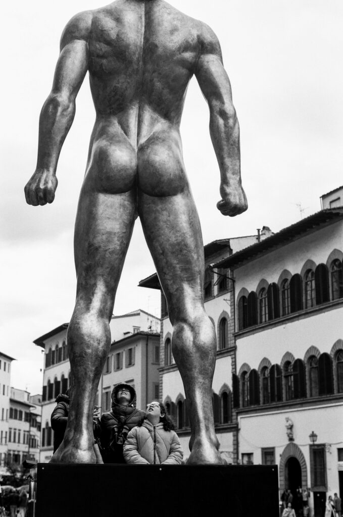Two people looking at statue 