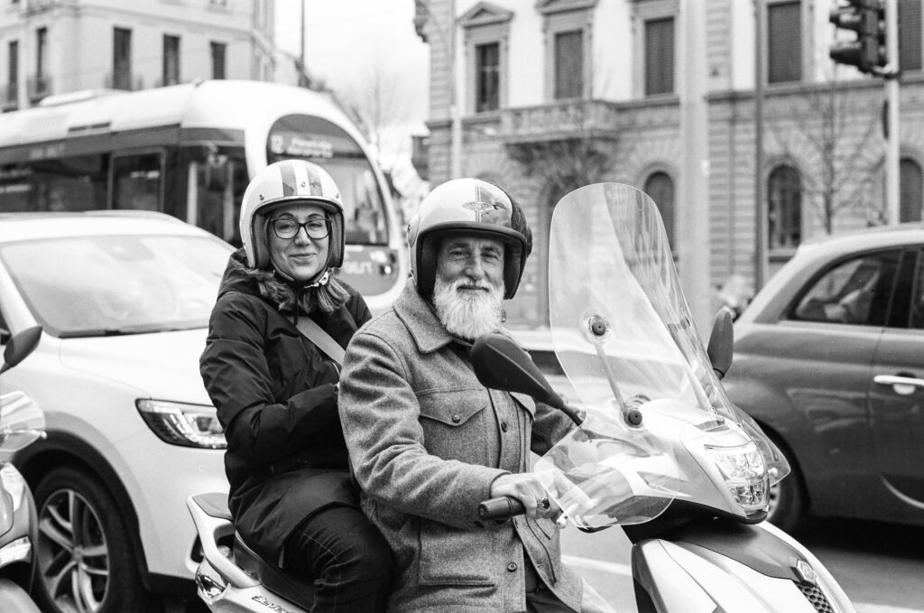 Two people on a scooter