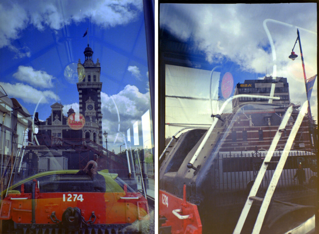 Two reflection shots. Intentional on left with historic railway station reflected in glazed enclosure for displayed loco. Right hand despite holding camera close to glass.