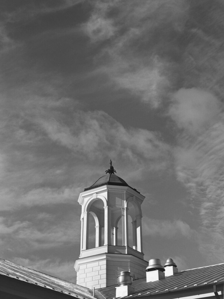 A cupola against a cloudy sky