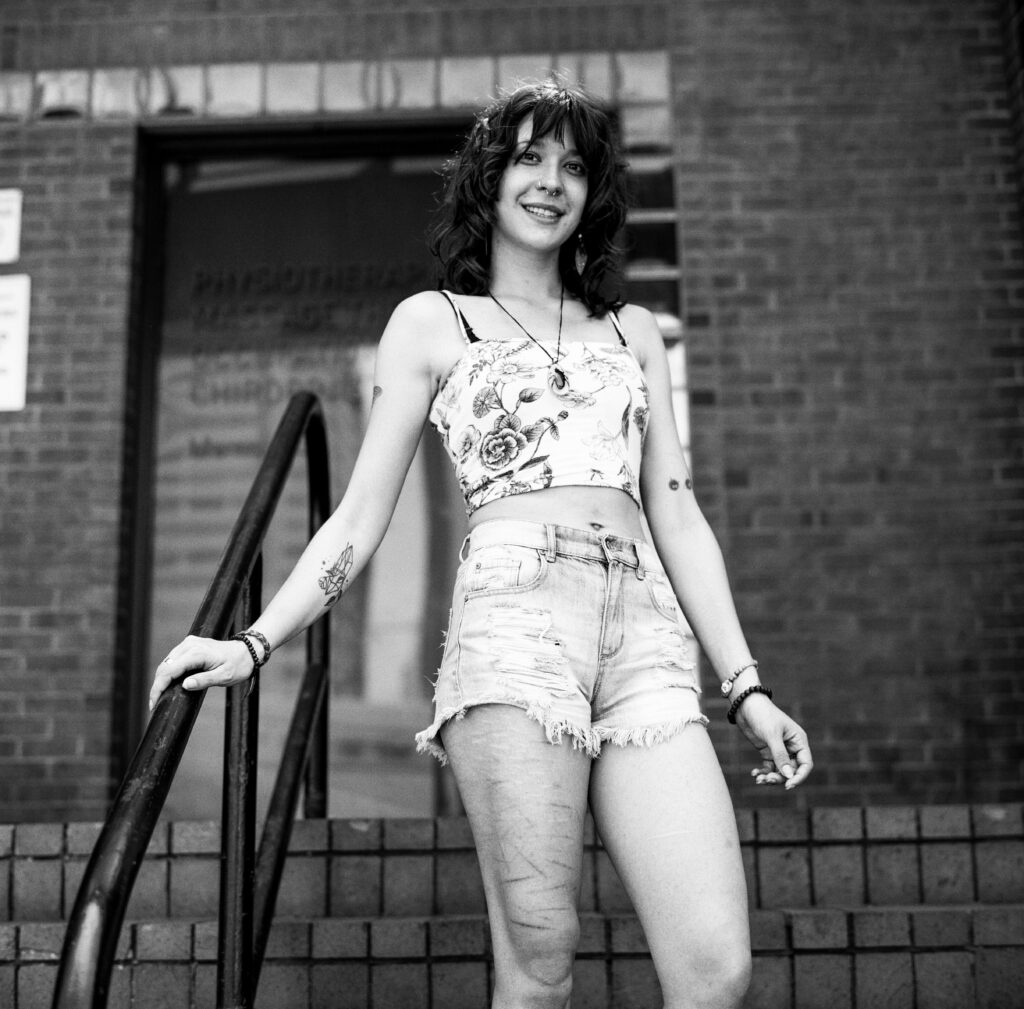 Young woman standing on steps