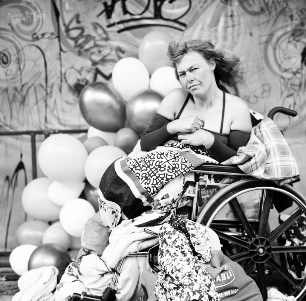 Woman in wheelchair with balloons