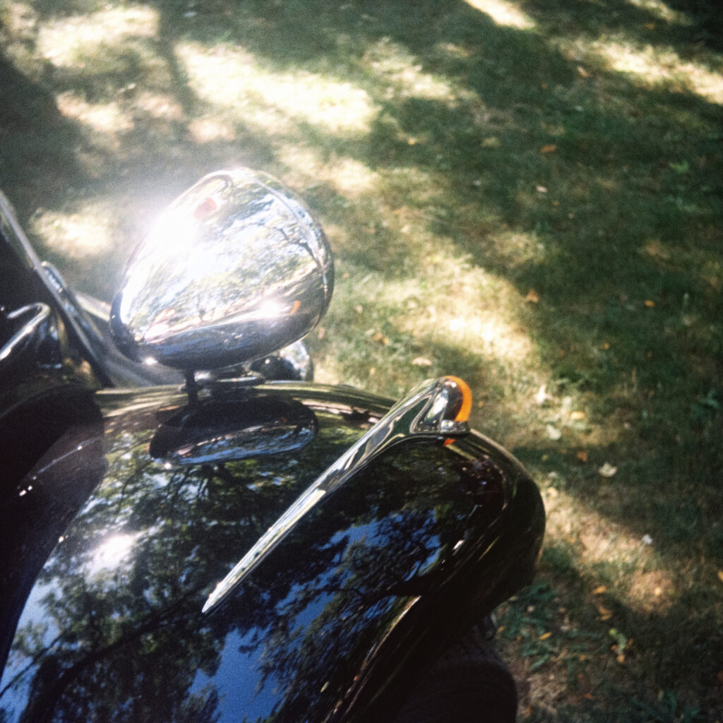 A close-up of a Citroën Traction Avant's headlight.
