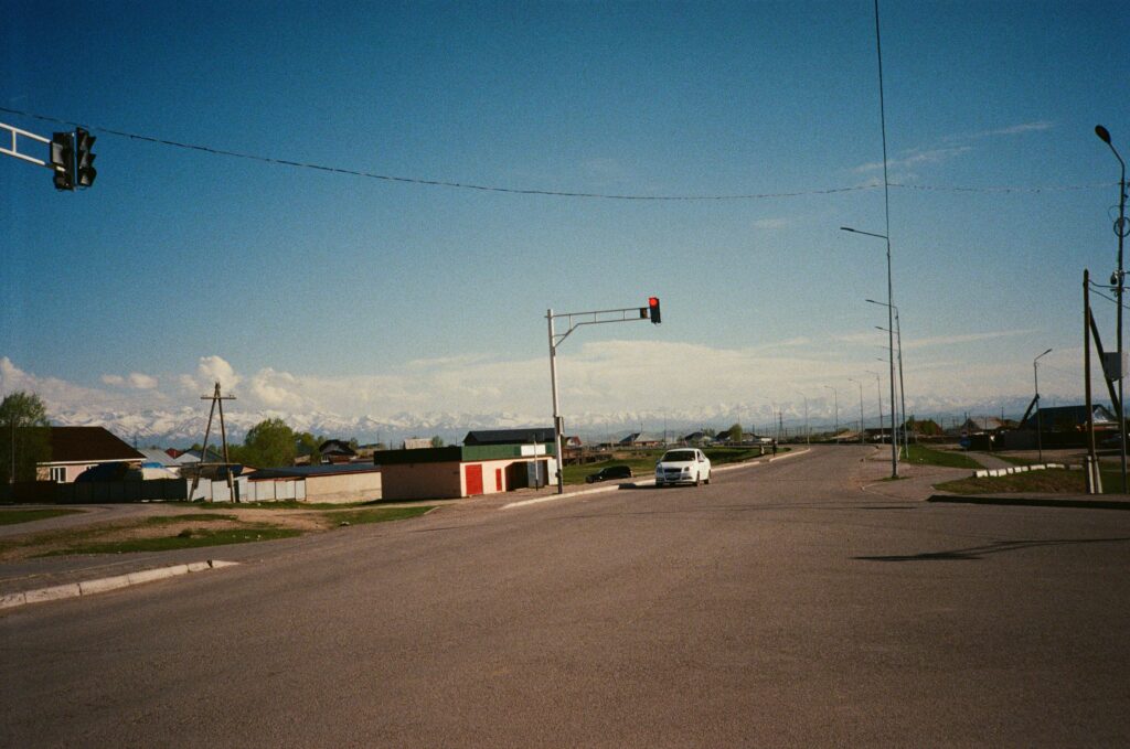 Empty traffic junction in central asia, with mountain in the background