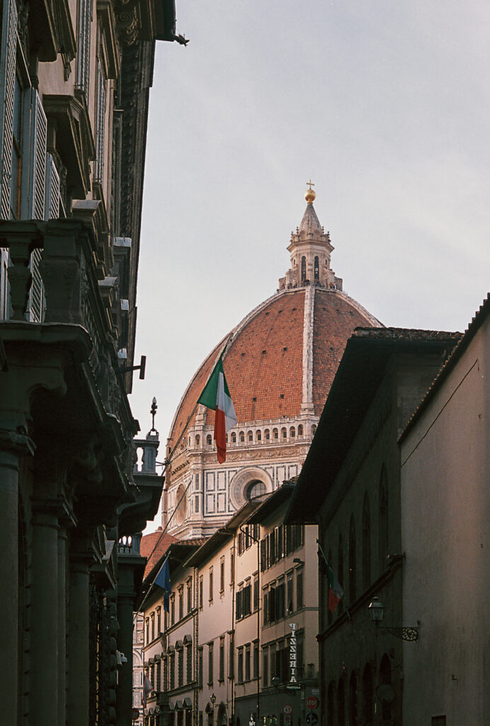The cathedral dome seen peering above a street