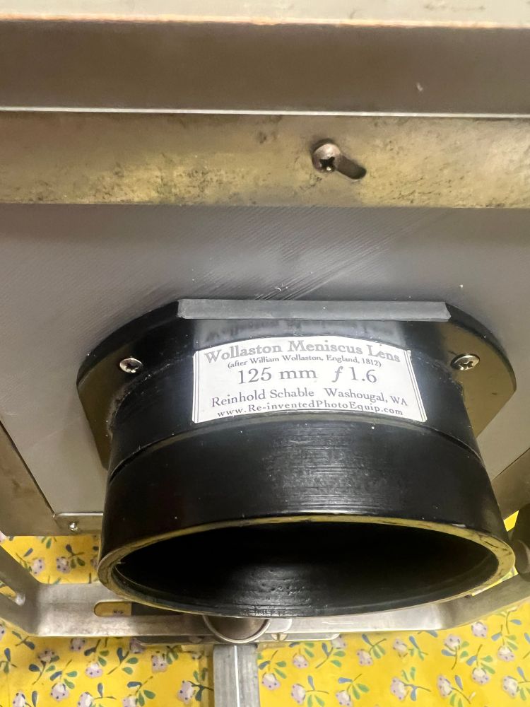 A view of the Wollaston Meniscus lens mounted on a board.