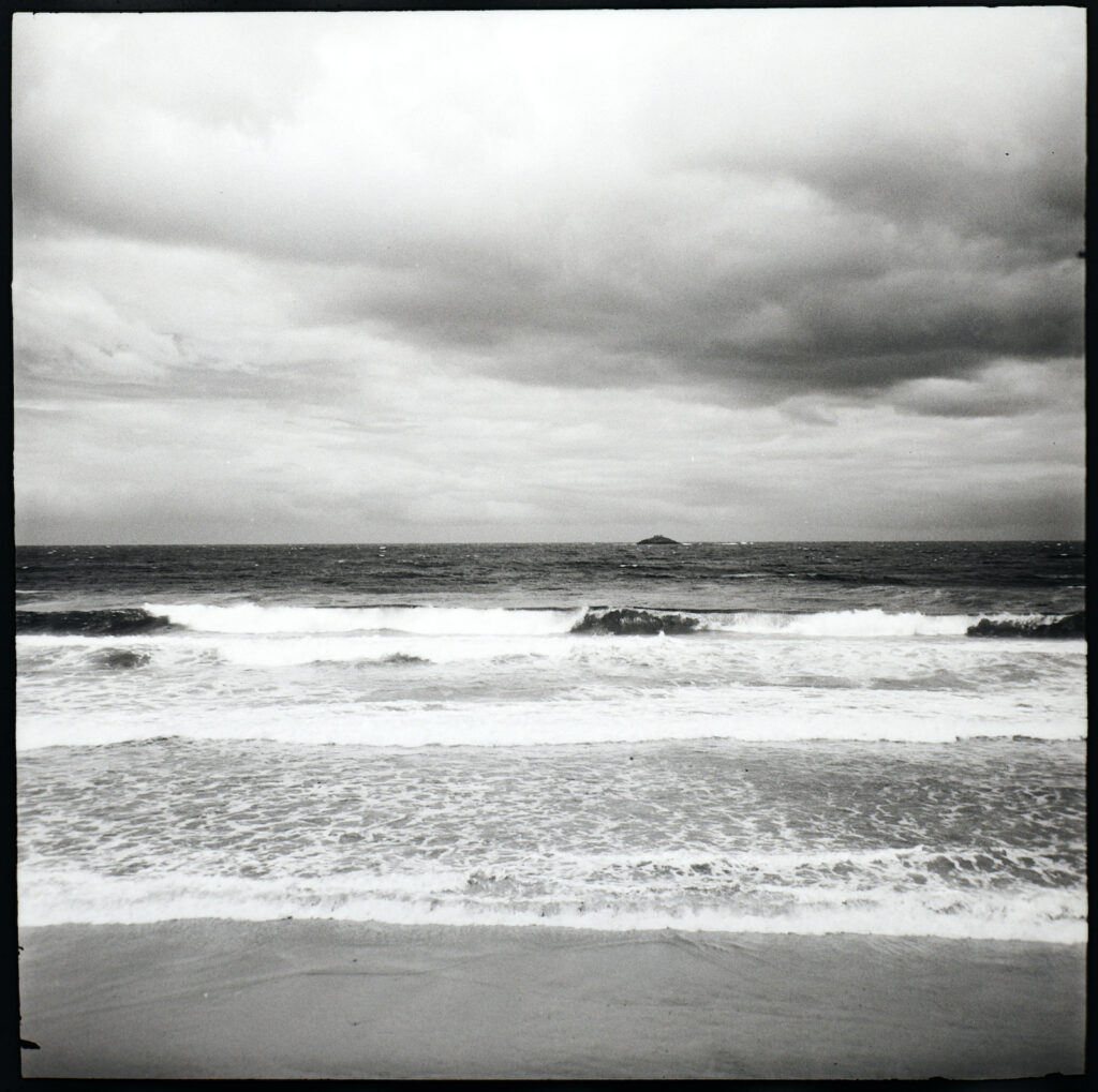 St. Clair, Dunedin with White Island (not the volcanic one up north) - next stop South America. Red filter.
