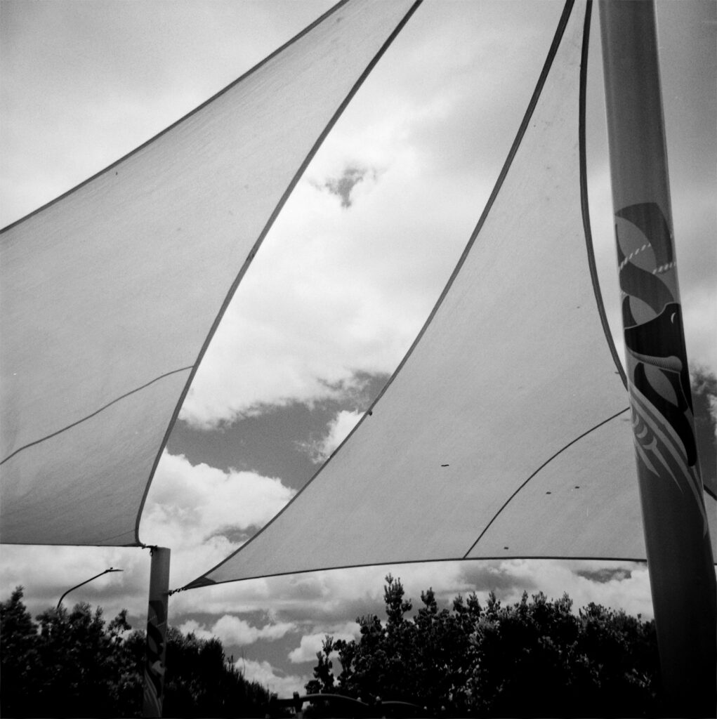 Shade sails, children’s playground, St. Clair. Red filter.