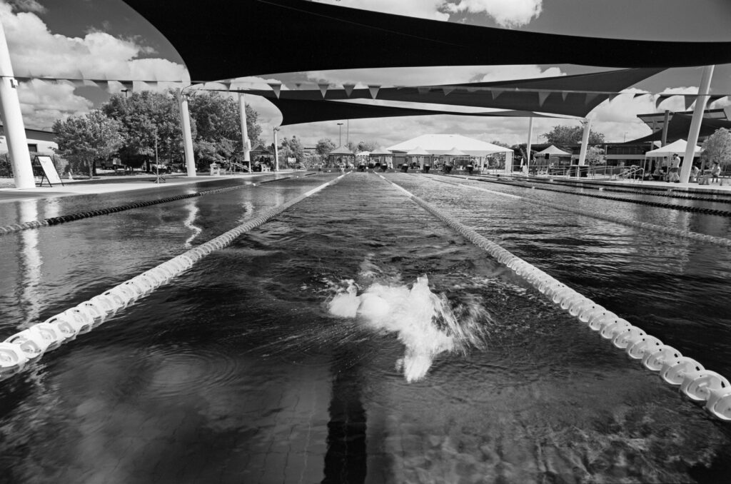 Retro 80S red filter Northern Beaches pool swimmer