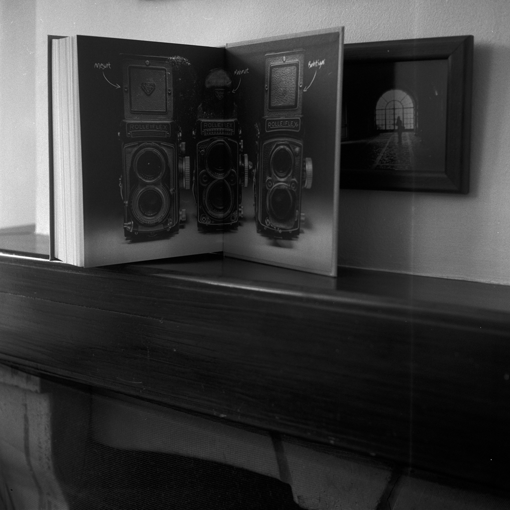 Three Rolleiflex Cameras on a book page