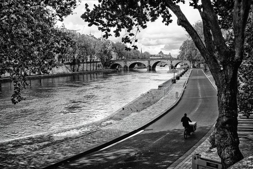 Paris bicyclist riding along Seine River