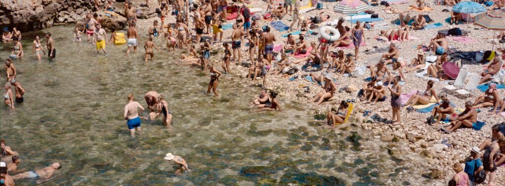 People swimming on the a warm summer day in Italy, shot on the Hasselblad Xpan and shot by Tom Kluijver