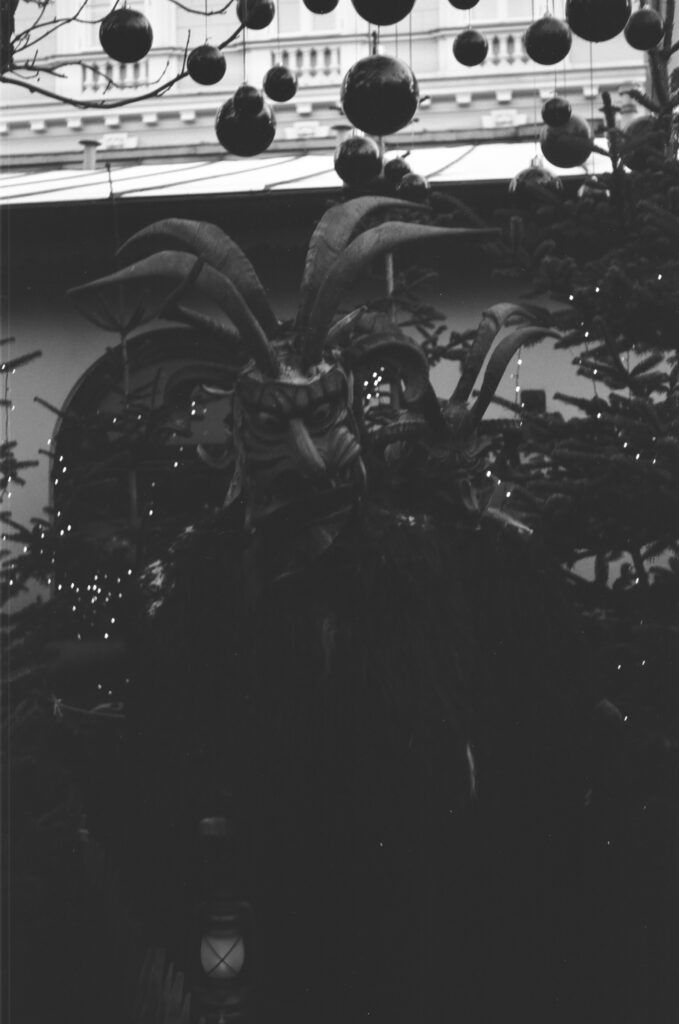 wooden Krampus statues on Christmas market