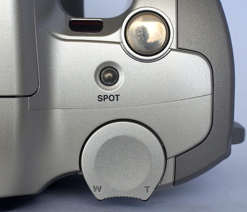 Shutter release, spot meter button and zoom control all nicely placed.