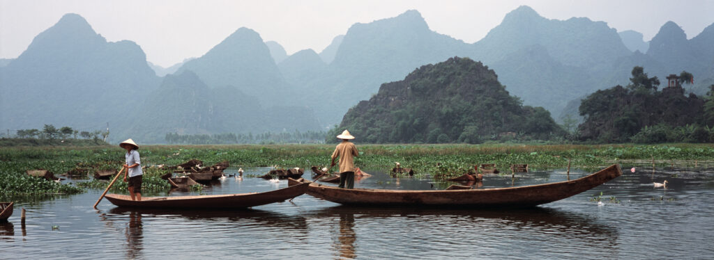 Vietnam river boats and mountains