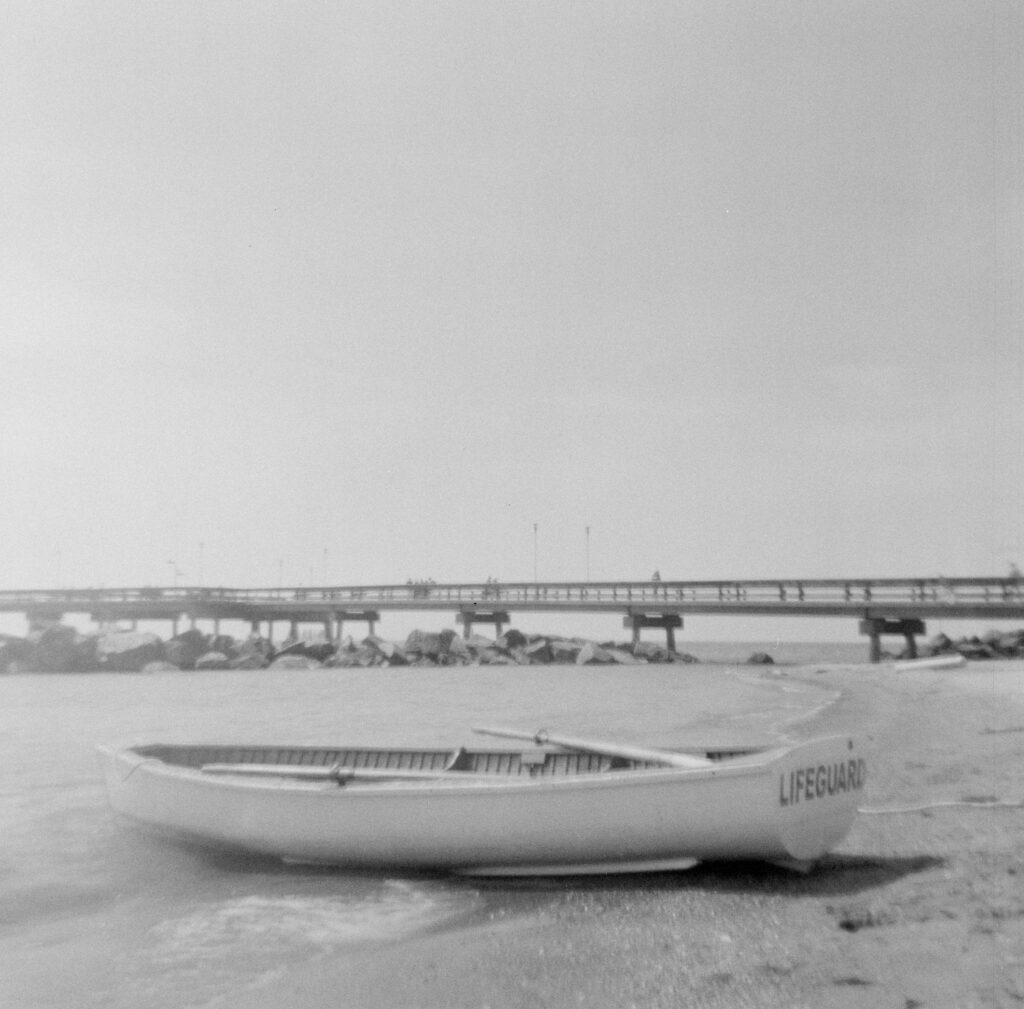 A lifeguard boat on a beach on the Toronto Islands