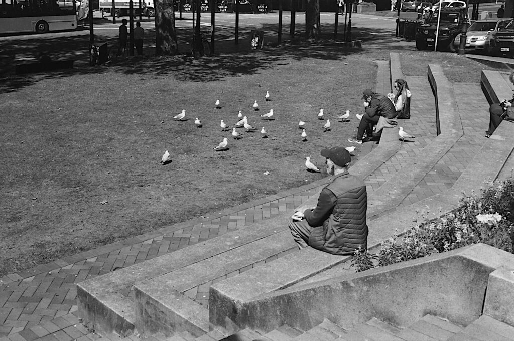 Hopeful spectators at lunchtime, The Octagon, Dunedin - Olympus.