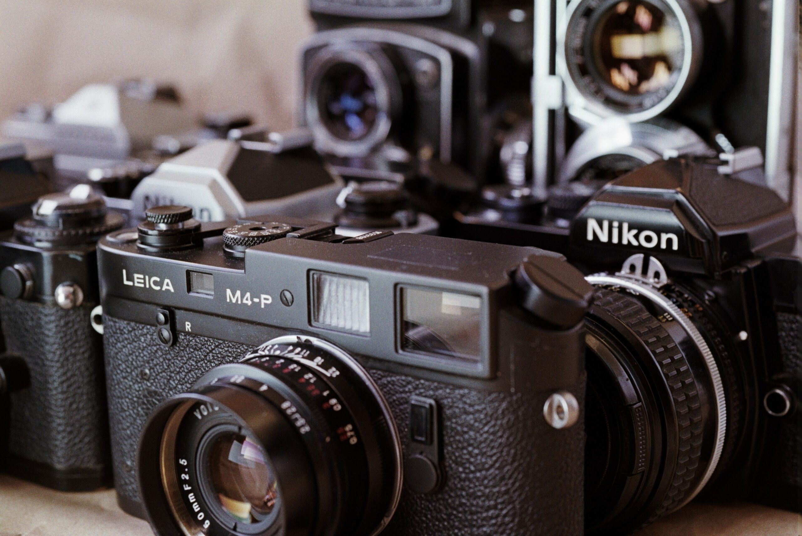 A close up of several cameras bunched together