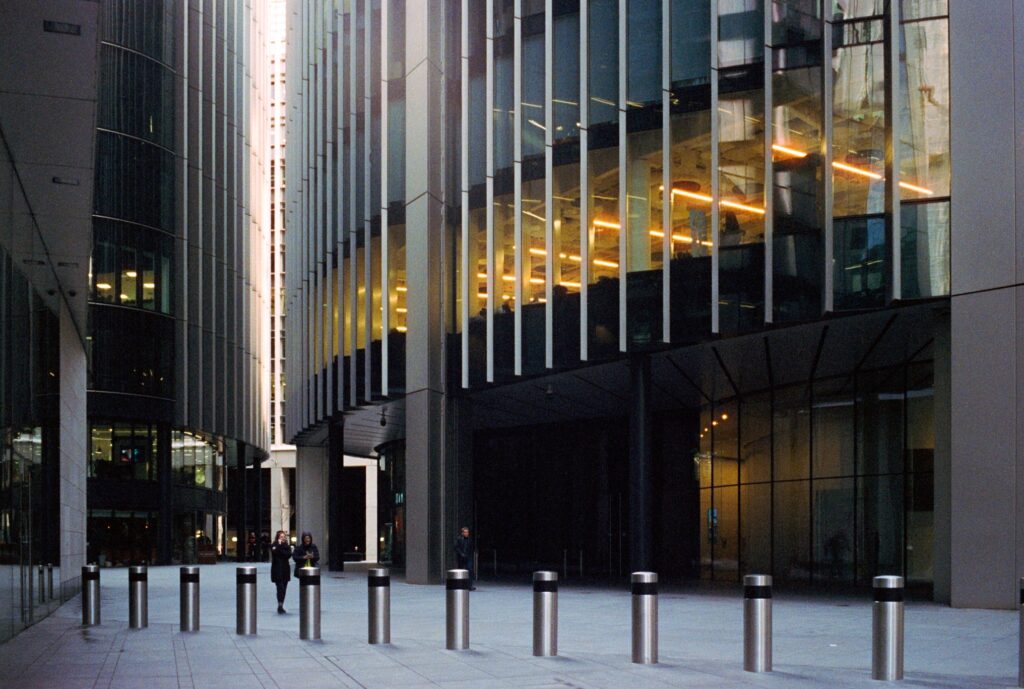 A London City street between offices with bollards on the footpath