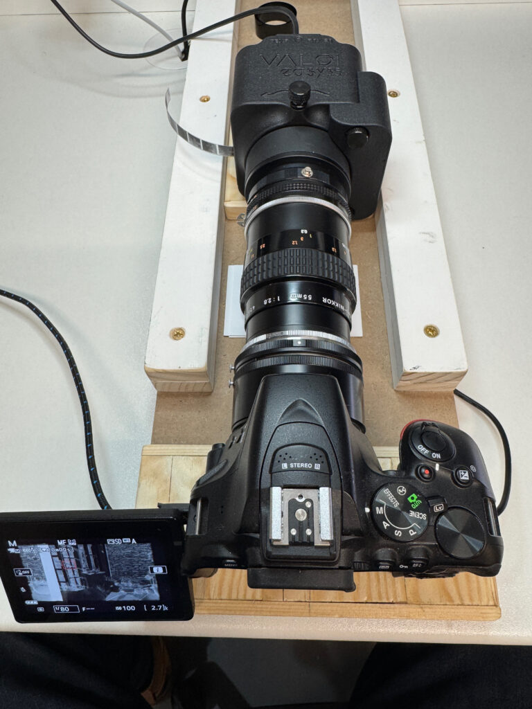 Camera with attachments on wooden frame