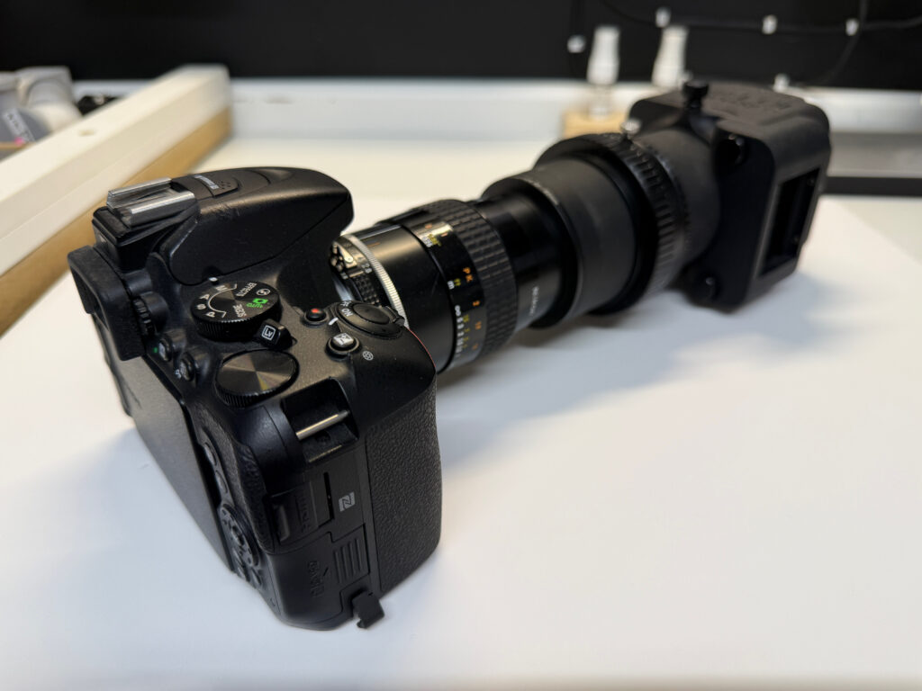 Digital camera with lens, extension tubes and light box