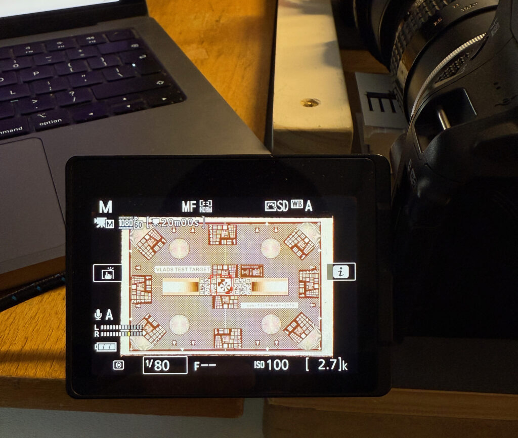 digital camera screen showing settings and an image of geometric shapes 