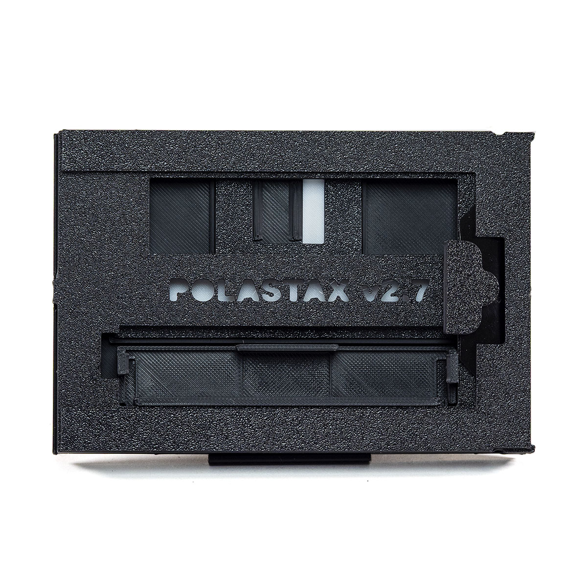 PolaStax Instax Wide film holder shown with the safety cap stowed and the dark slide closed.