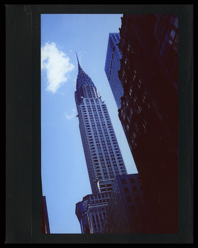 Instax Wide image of the Chrysler Building surrounded by a black frame.