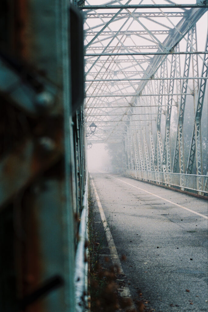 Image of a bridge in the fog.
