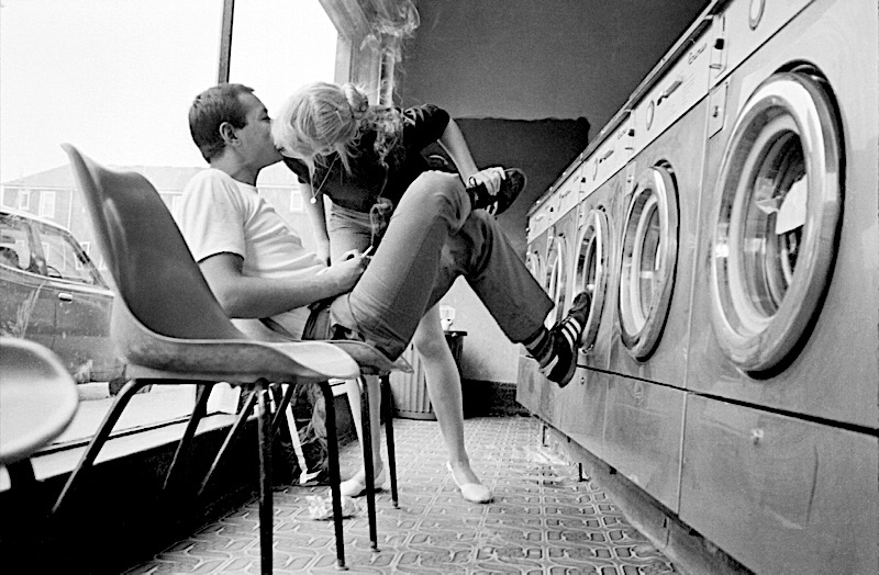 © Phil Maxwell, The Kiss, Brick Lane Laundrette, early 1980s. Shot on an Olympus XA2.