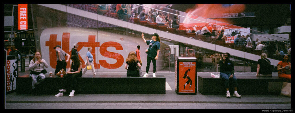 A selfie is snapped from atop one of the stone benches in Times Square.