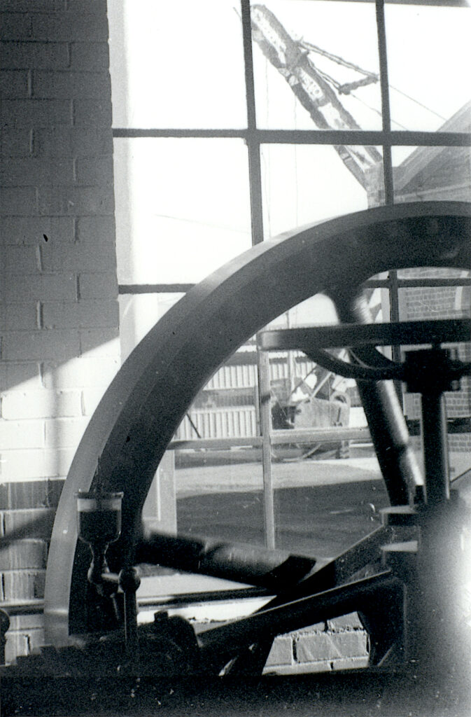 The same flywheel with a huge, UK made, caterpillar tracked, mobile crane in the yard outside.