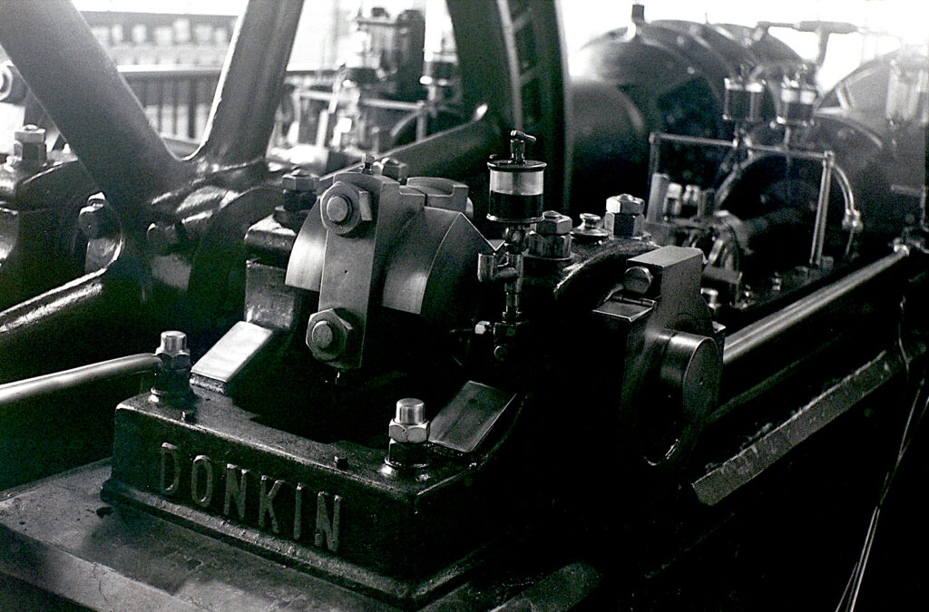 Complex detail of the castings, components and assemblies needed to make these machines work accurately. Tele attachment.