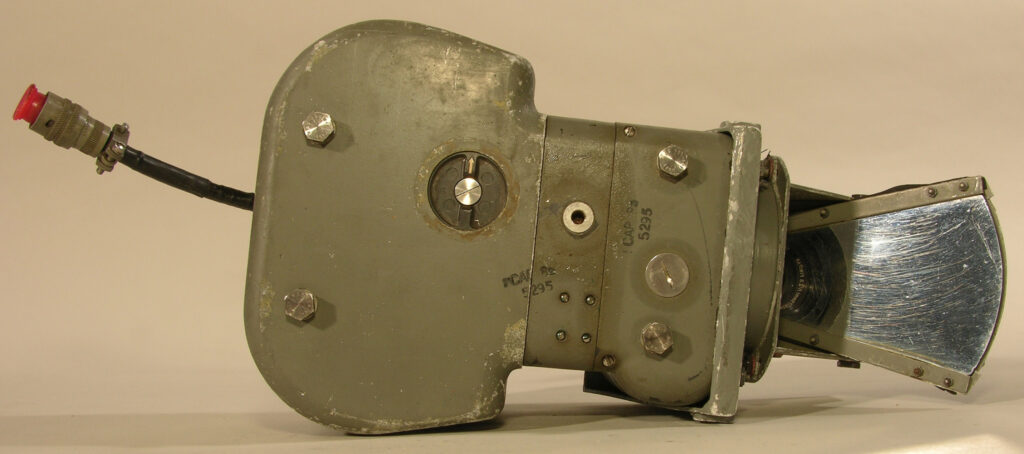 A grey camera with a mirror attached