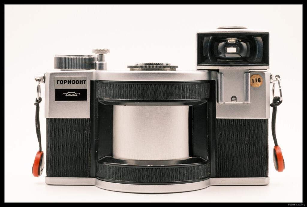 A head-on view of a KMZ Horizont with its accessory viewfinder and soft shutter release attached